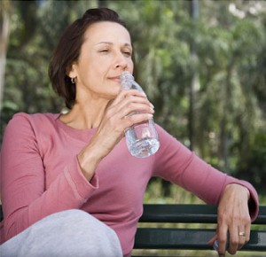 Over 50 woman drinking water
